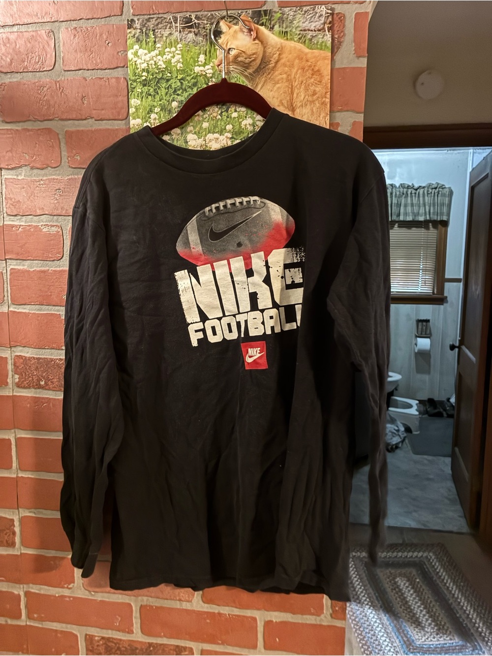 Nike Black Long Sleeve Football Tee with White and Red Graphic